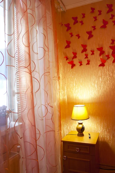 Bedroom interior with curtains, the lamp