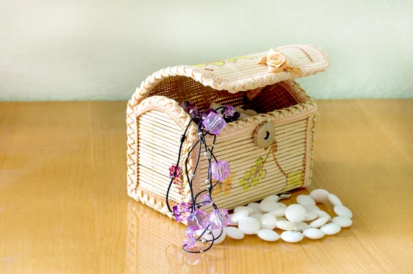 Various women's beautiful jewelry in a wicker box