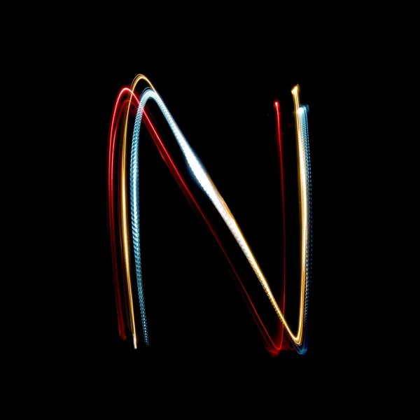 Letter N made from brightly coloured neon lights