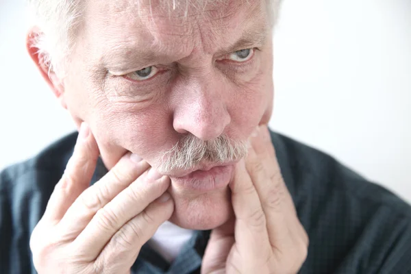 Tooth or cheek pain in older man