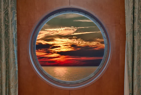 Dramatic Sunset Seen Through a Ship Porthole