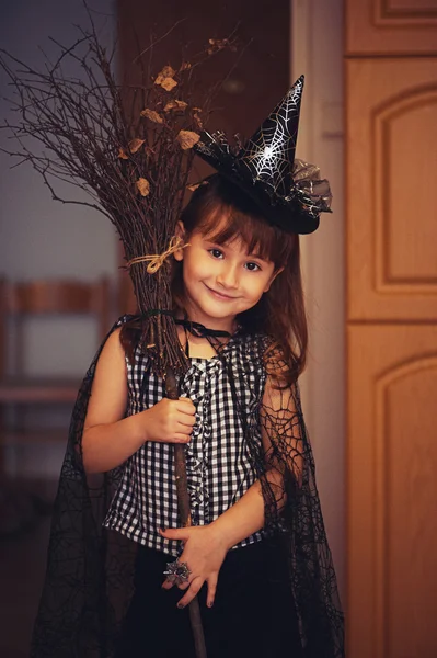 Little witch with broom