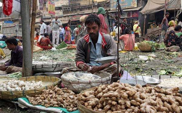 Street trader sell vegetables outdoor in Kolkata India