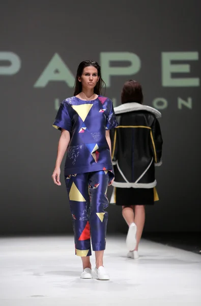 Fashion model wearing clothes designed by Paper London on the Zagreb Fashion Week on May 09, 2014 in Zagreb, Croatia