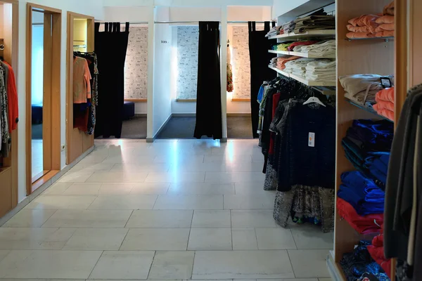 Interior of brand new fashion clothes store
