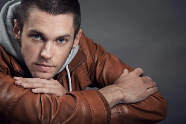 Portrait of a good looking man in classic leather jacket