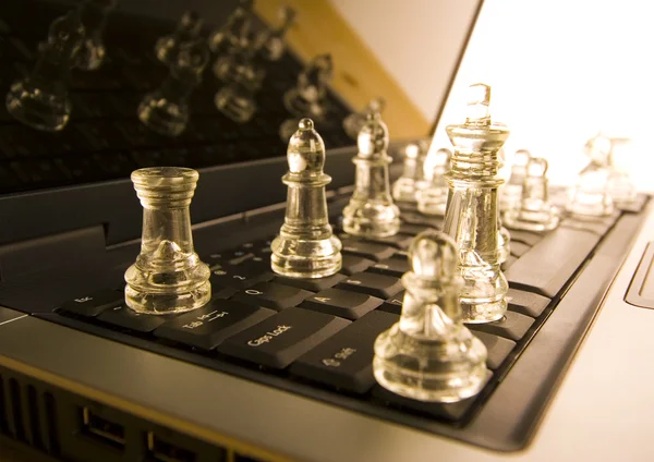 Glass chess with laptop