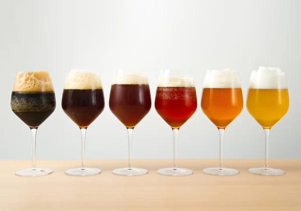 Six glasses with different beers