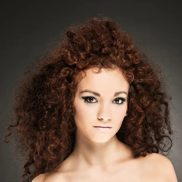 Beauty portrait of curly hair woman