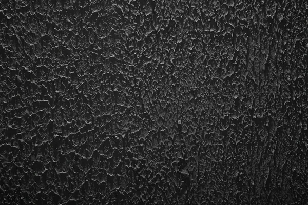 Grunge texture, rough ragged dark background, black plaster stucco wall