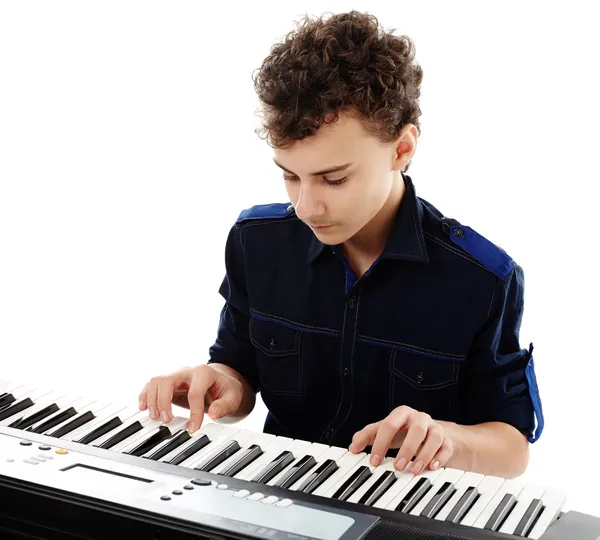 Teenager playing an electronic piano