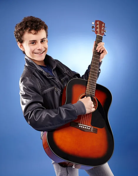 Teenager playing guitar
