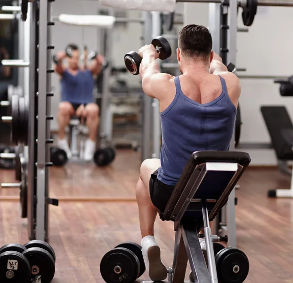 Man working out in front of the mirror
