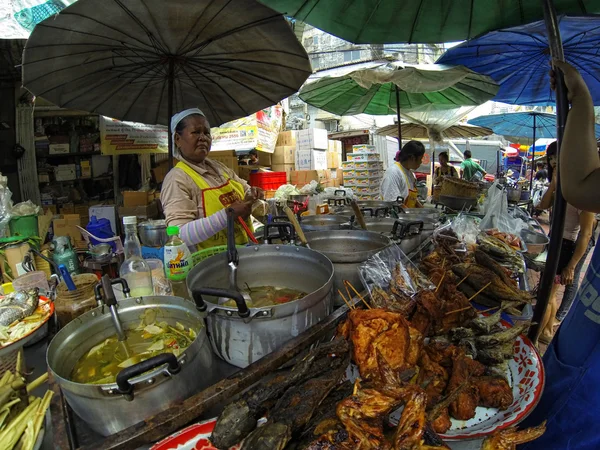 People trade at the street market in bangkok