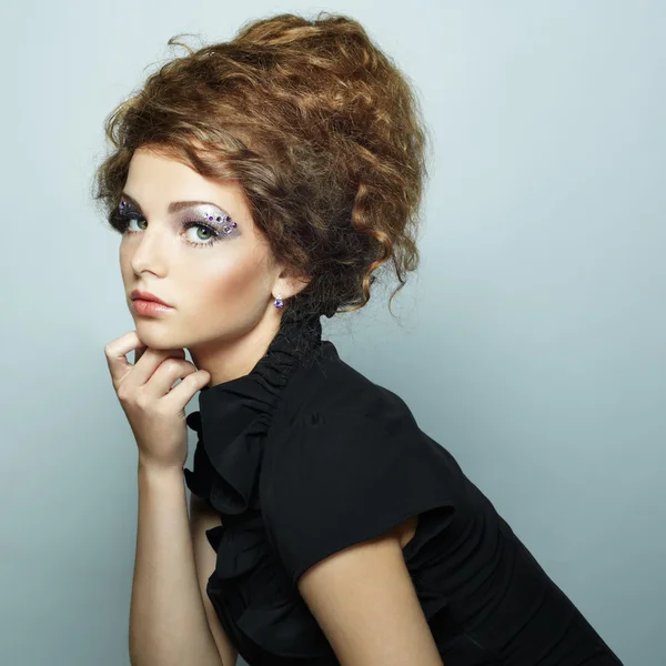 Portrait of beautiful woman with elegant hairstyle