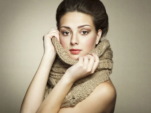 Portrait of a beautiful young woman with scarf
