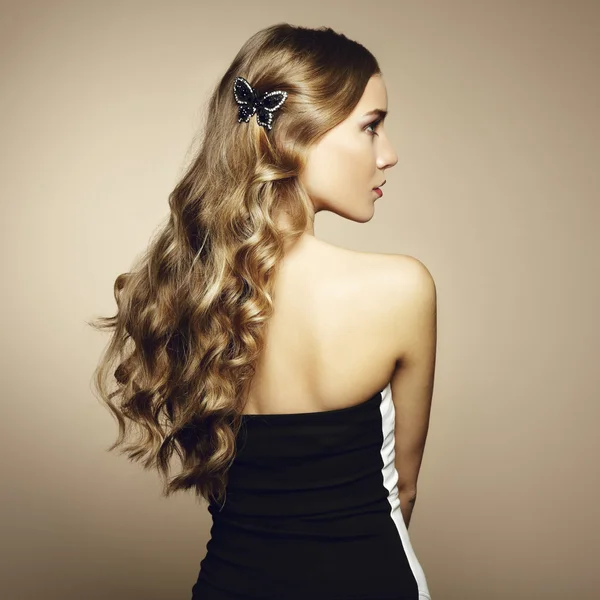 Portrait of beautiful blonde woman in green dress