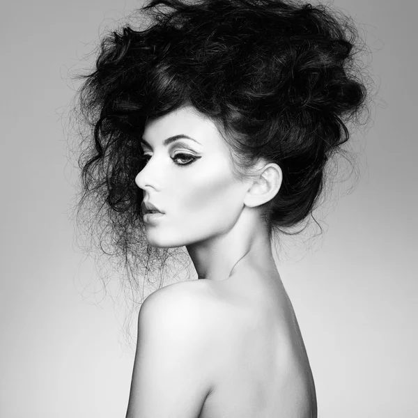 Black and white photo of beautiful woman with magnificent hair