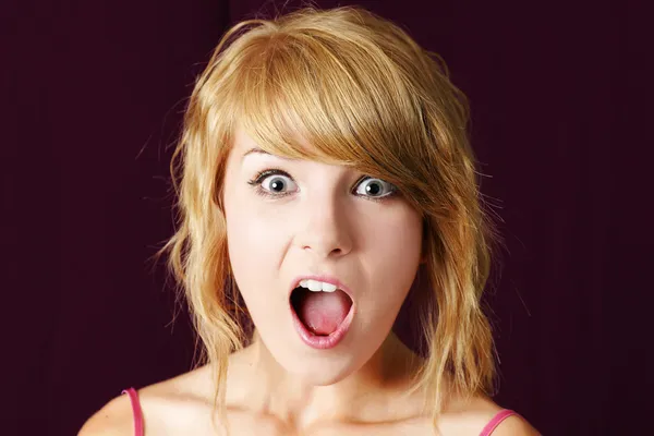 Very surprised or shocked young blonde