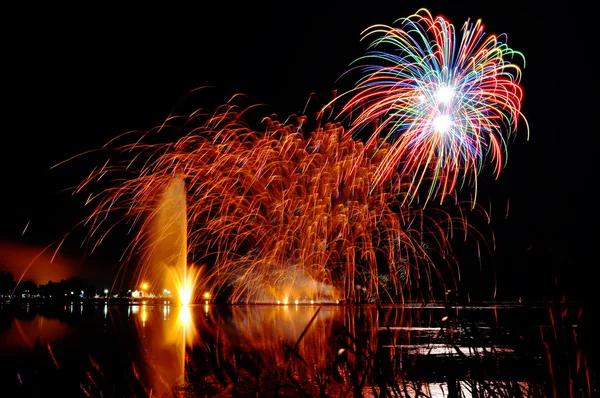 Magrnificient fireworks over a lake