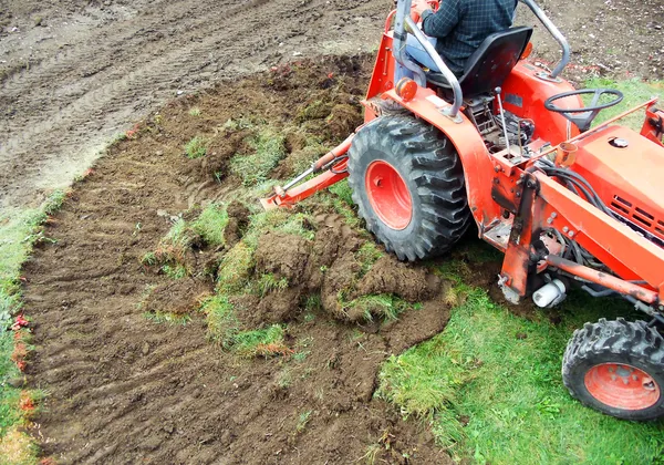 tractor emoving turf — Stock Photo #22066775