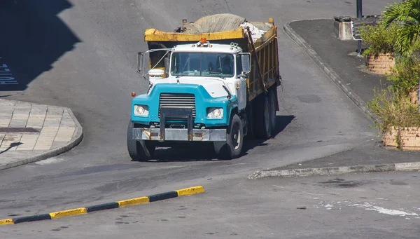 Blue Dump Truck Rolling with Full Load