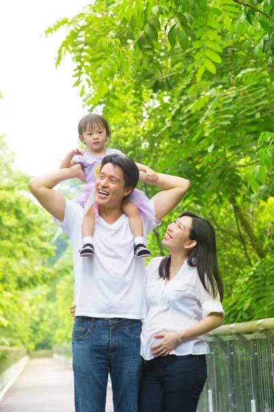 Happy Asian family outdoor fun.