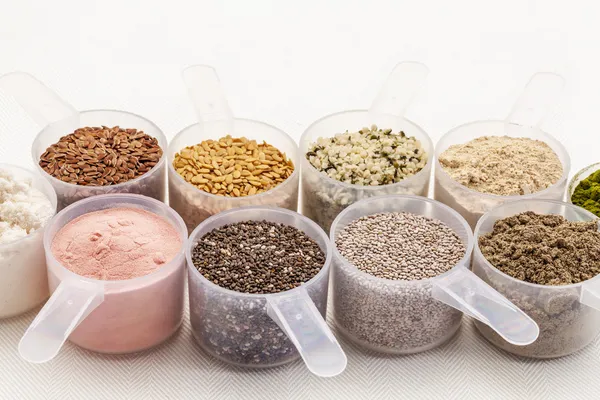 Scoops of seeds and powders