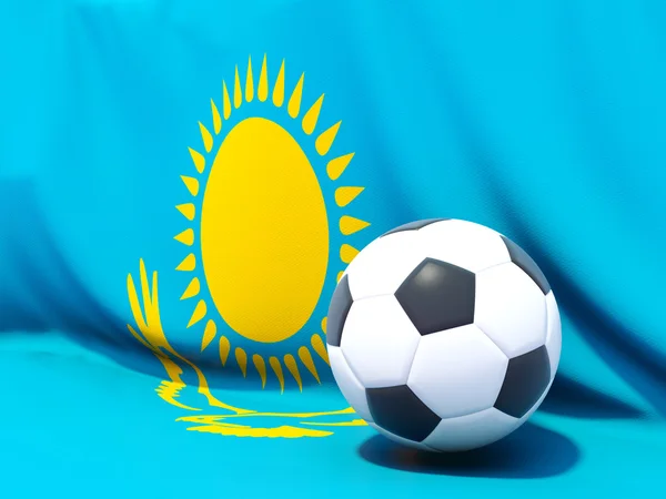 Flag of kazakhstan with football in front of it