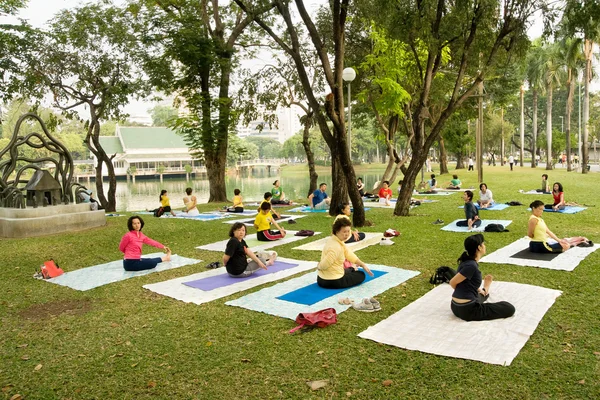Group Yoga Practice in Park