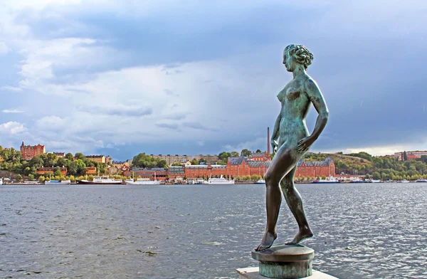 Statue of naked woman in Stockholm near the water, Sweden