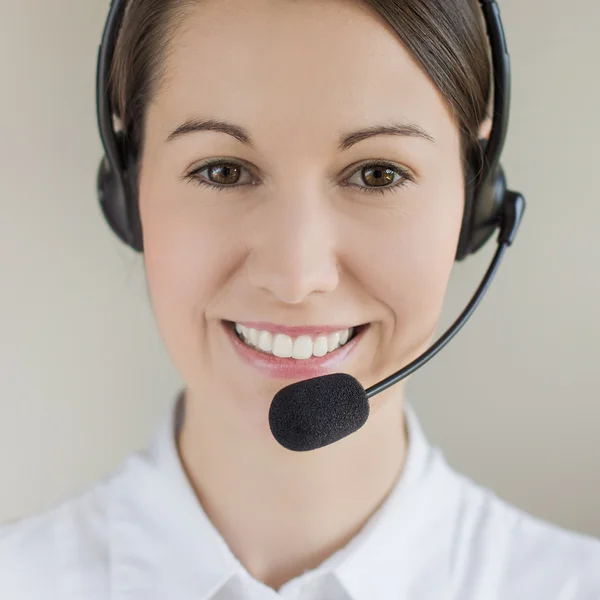 Successful female call centre employee speaking
