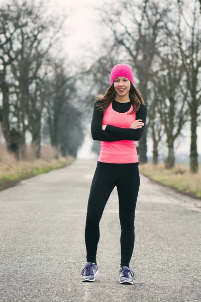 Runner - woman running outdoors training for marathon run