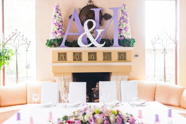 Bride and groom\'s table decorated with flowers