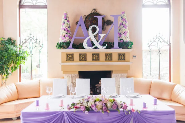 Bride and groom\'s table decorated with flowers
