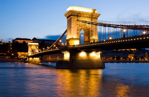The Chain Bridge in Budapest lit by the street lights