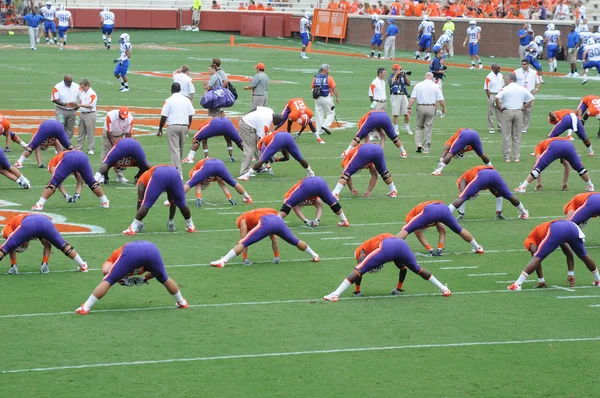 Clemson football players stretching