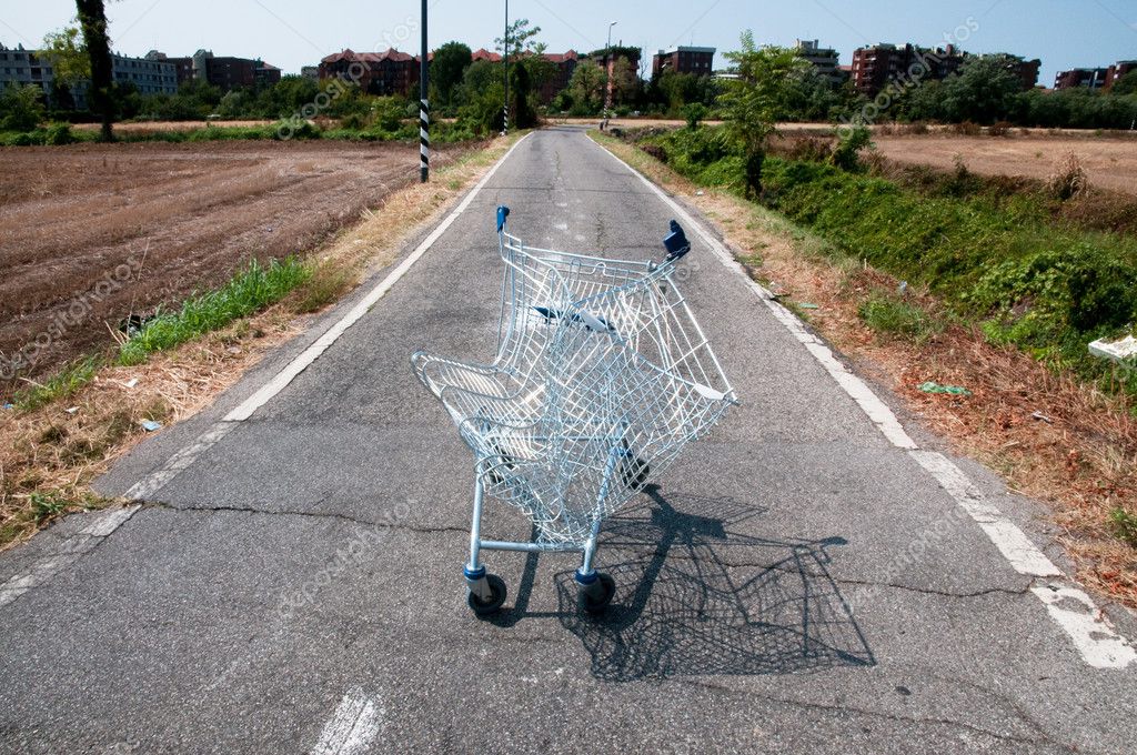 Broken shopping cart in a street campaign — Stock Photo © moreno