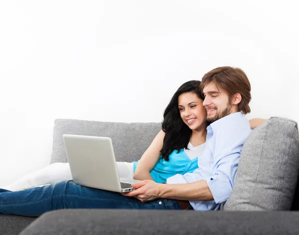 Young couple using laptop