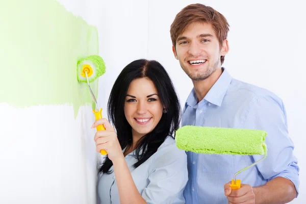 Couple paint in green color white wall