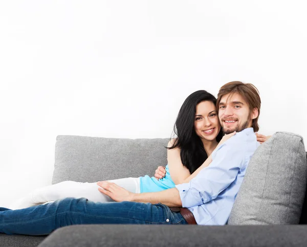 Young couple sitting on the sofa
