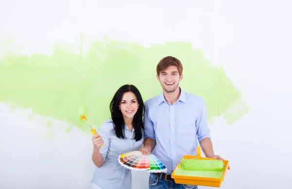 Couple paint in green color white wall