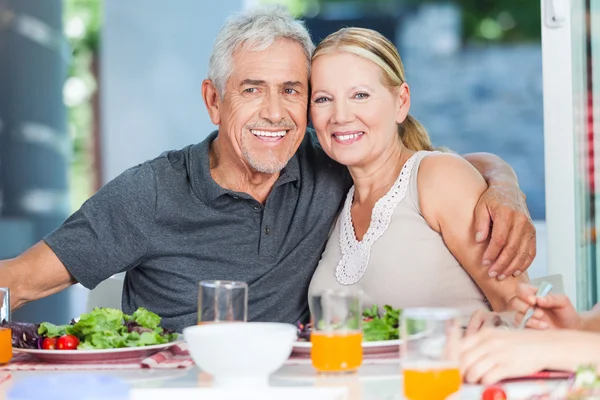 Mature couple having lunch