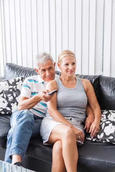 Senior couple watching tv