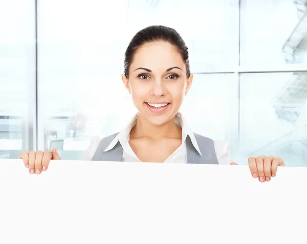 Businesswoman holding white card board