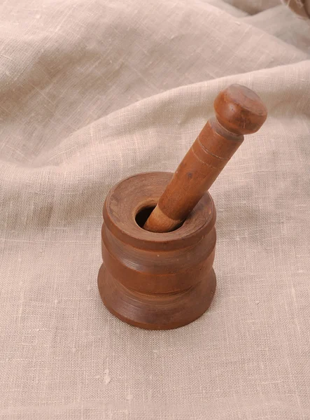 Old used wooden mortar and pestle