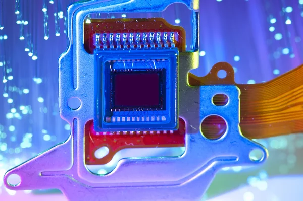 CCD sensor on a card of digital camera with fiber optical background