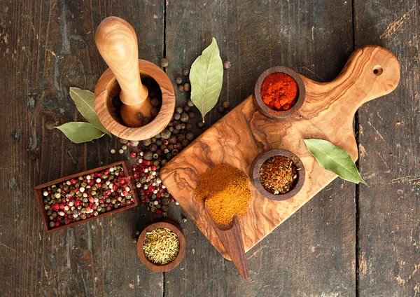 Spices and herbs on old wooden desk