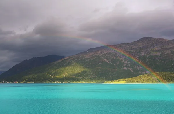 Colorful rainbow over water