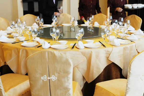 Chinese luxury restaurant banquet table setting.